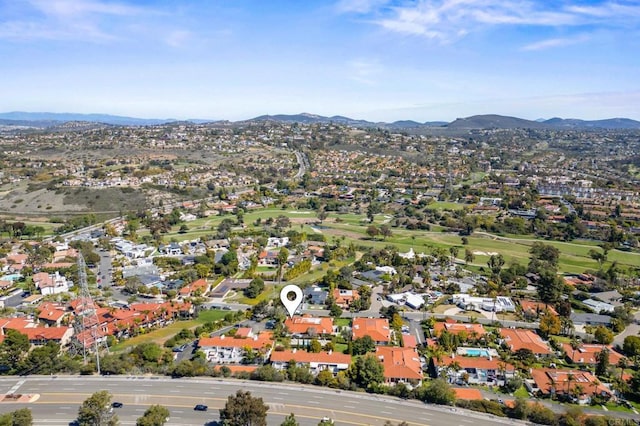 birds eye view of property with a mountain view and a residential view