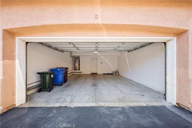 garage featuring secured water heater