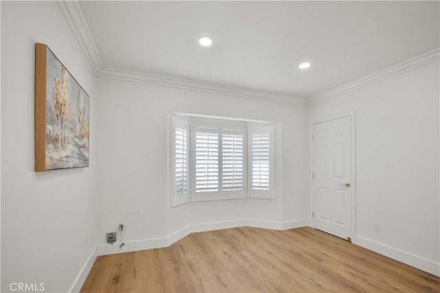 unfurnished room with recessed lighting, wood finished floors, baseboards, and ornamental molding