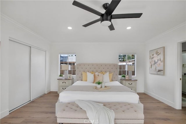 bedroom with recessed lighting, baseboards, light wood-style flooring, and crown molding