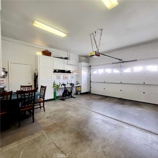garage featuring a garage door opener
