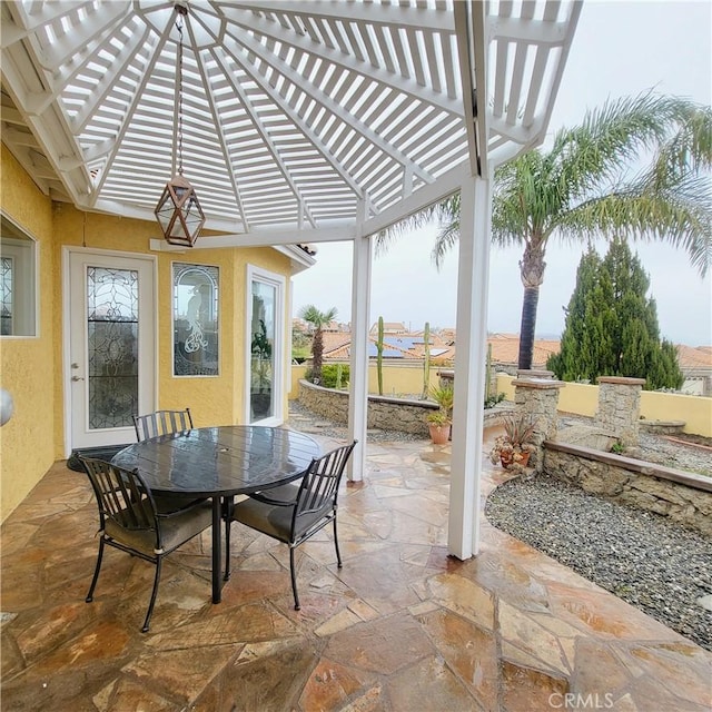 view of patio / terrace featuring outdoor dining space and a pergola