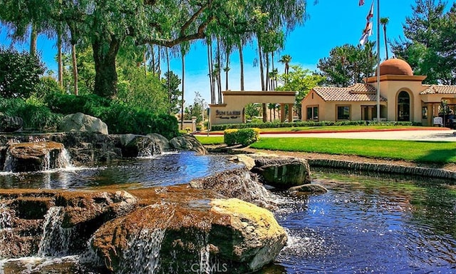 surrounding community featuring a yard
