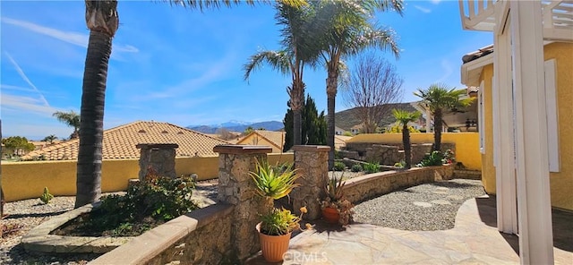 exterior space featuring a mountain view and fence