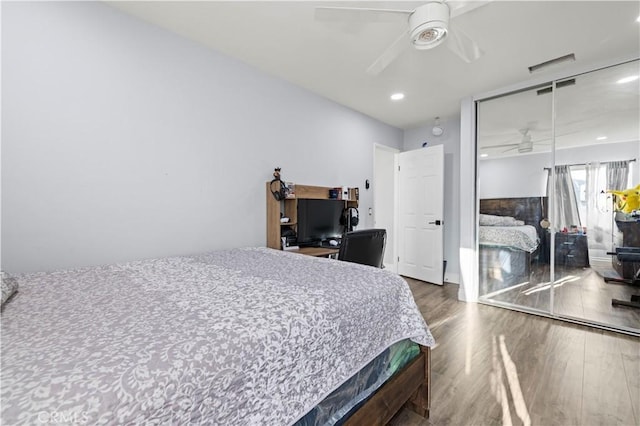 bedroom featuring a closet, recessed lighting, ceiling fan, and wood finished floors