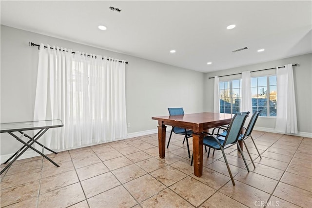 dining space featuring light tile patterned flooring, recessed lighting, and baseboards