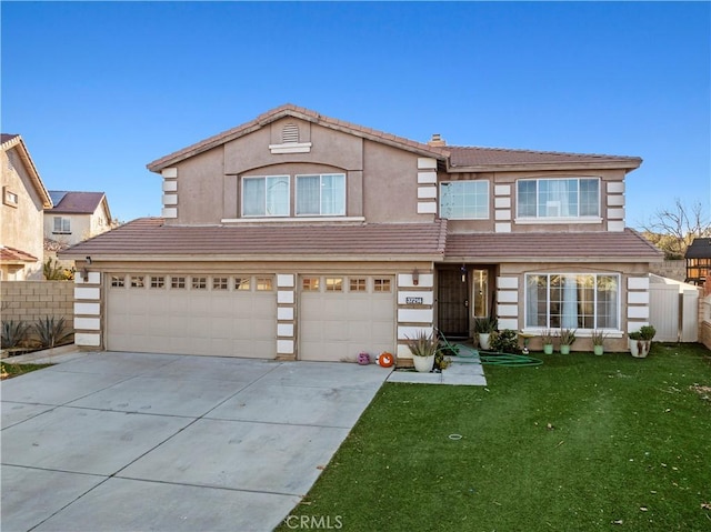 traditional-style home with a tile roof, concrete driveway, fence, and an attached garage