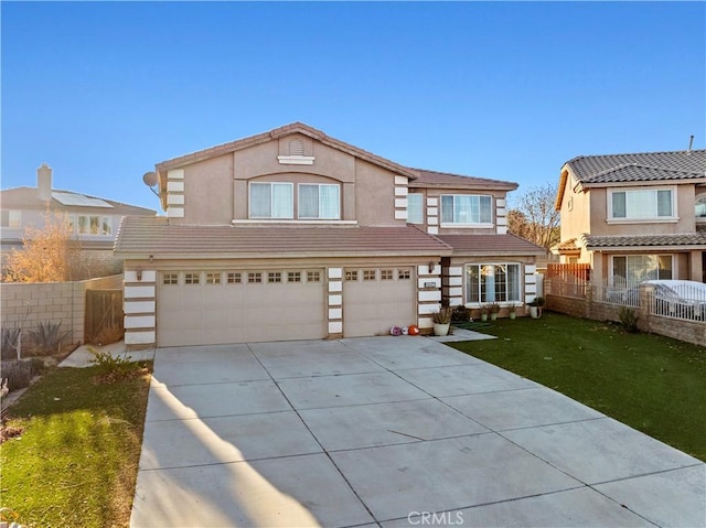 traditional-style home with stucco siding, driveway, a tile roof, fence, and an attached garage