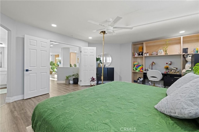 bedroom featuring recessed lighting, baseboards, and wood finished floors