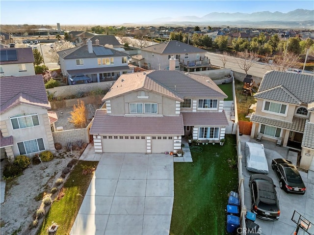 birds eye view of property featuring a mountain view and a residential view