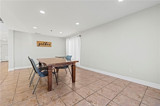 dining room featuring recessed lighting, baseboards, and light tile patterned flooring