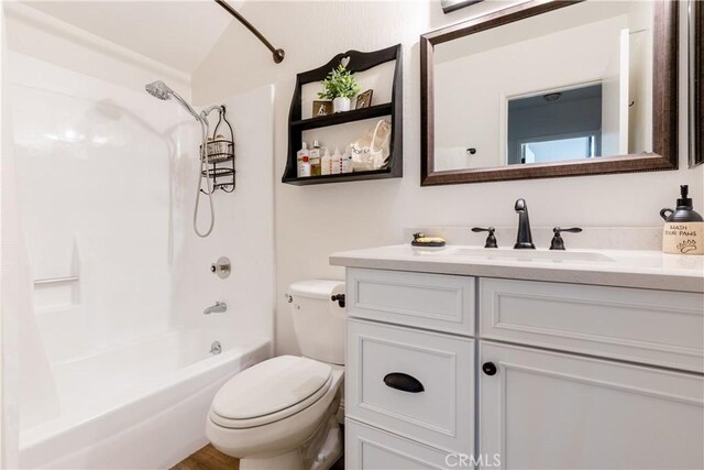 full bathroom with vanity, toilet, and shower / washtub combination