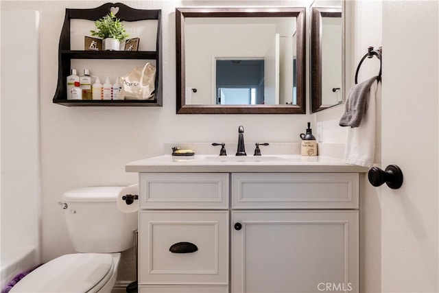 bathroom with vanity and toilet