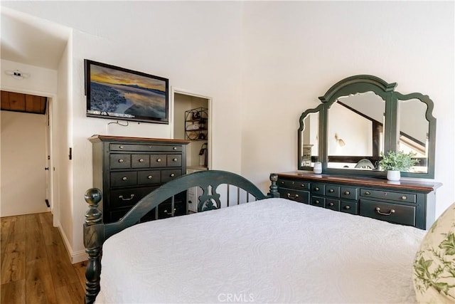 bedroom with wood finished floors