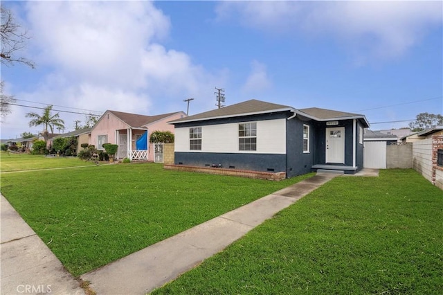 bungalow-style home featuring crawl space, a front lawn, and fence