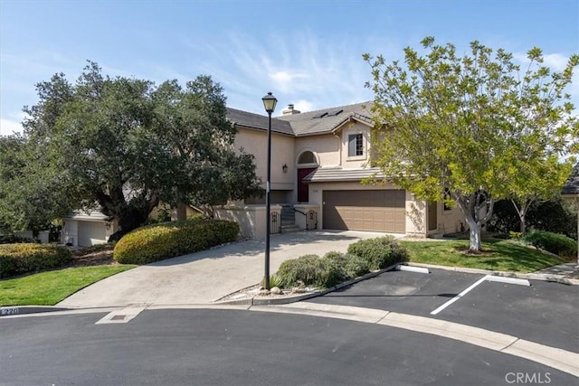 view of front of property with a front yard and stucco siding