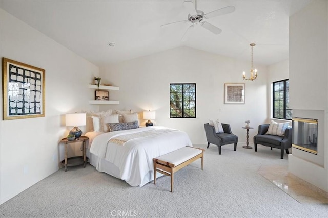 bedroom with light colored carpet, ceiling fan with notable chandelier, and lofted ceiling