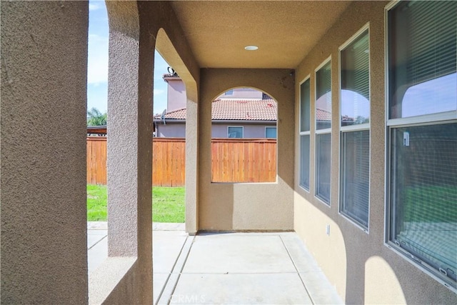 view of patio featuring fence