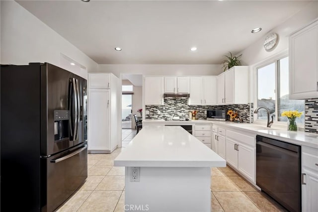 60125 Carrizo Rd, Mountain Center, CA 92561 - kitchen with a center island, tasteful backsplash, black appliances, and a sink