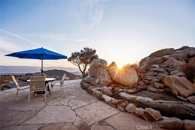 60125 Carrizo Rd, Mountain Center, CA 92561 - patio terrace at dusk with outdoor dining space