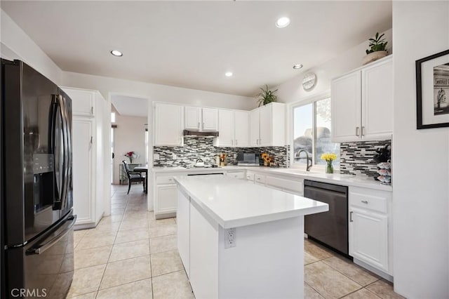 60125 Carrizo Rd, Mountain Center, CA 92561 - kitchen featuring a sink, stainless steel dishwasher, light countertops, decorative backsplash, and black refrigerator with ice dispenser