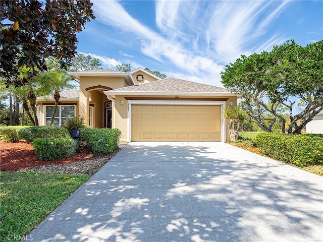 ranch-style house featuring stucco siding, concrete driveway, a garage, and a shingled roof