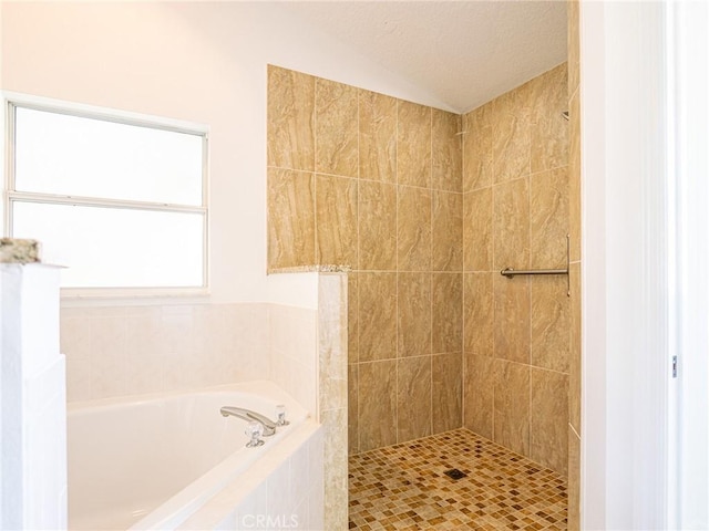 full bath with lofted ceiling, a bath, a tile shower, and a textured ceiling