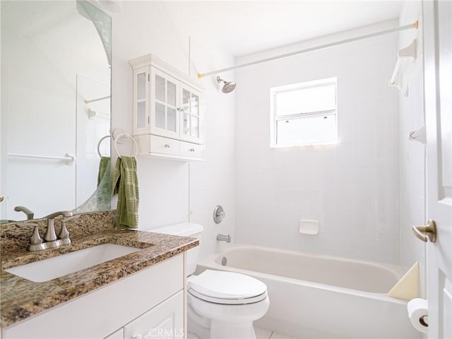 full bath featuring shower / washtub combination, toilet, and vanity