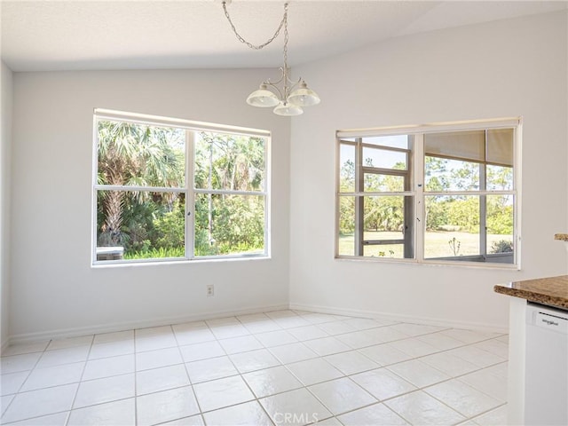 unfurnished dining area featuring light tile patterned floors, baseboards, an inviting chandelier, and vaulted ceiling