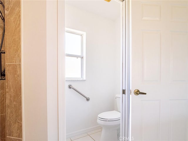 bathroom with tile patterned floors and toilet