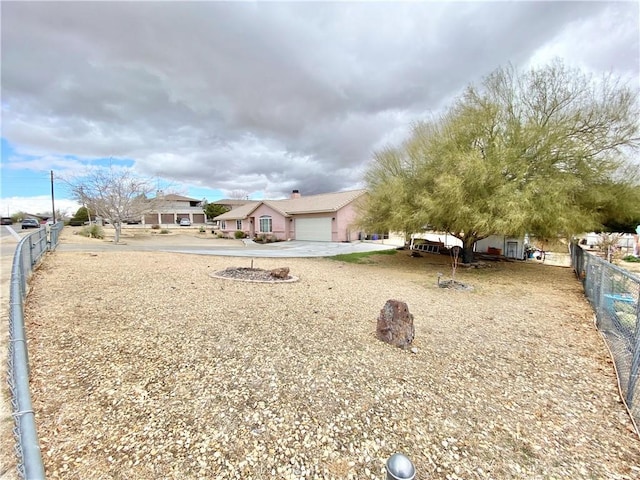 view of front of home featuring fence