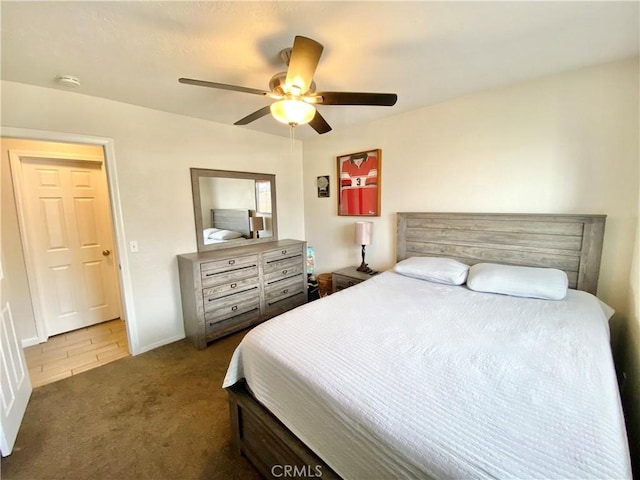 bedroom featuring baseboards, a ceiling fan, and carpet floors