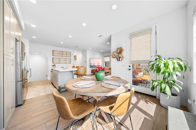 dining area with recessed lighting, visible vents, and light wood-type flooring