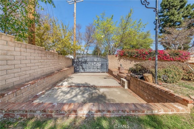 view of gate with fence