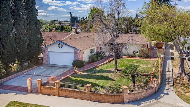 ranch-style home featuring a fenced front yard, a front yard, a garage, driveway, and a gate