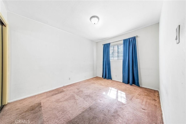 empty room with carpet flooring