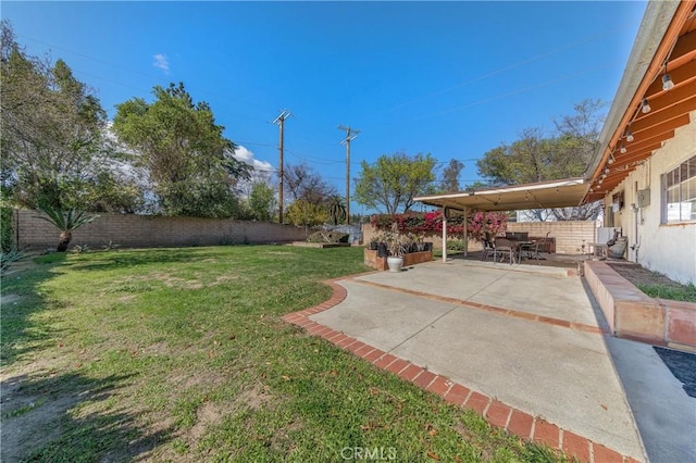 view of yard with a patio area and a fenced backyard