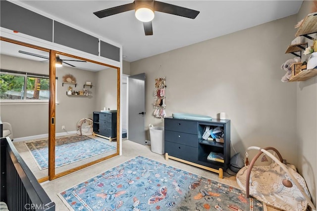 bedroom featuring baseboards and ceiling fan