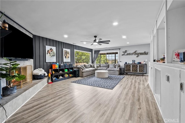 living area featuring recessed lighting, wood finished floors, and ceiling fan