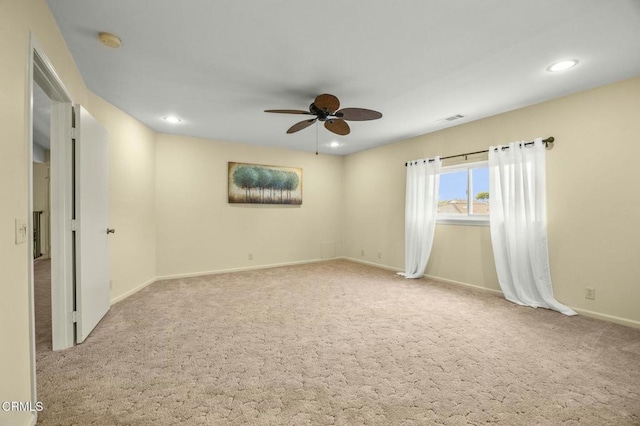 carpeted empty room with visible vents, recessed lighting, baseboards, and a ceiling fan