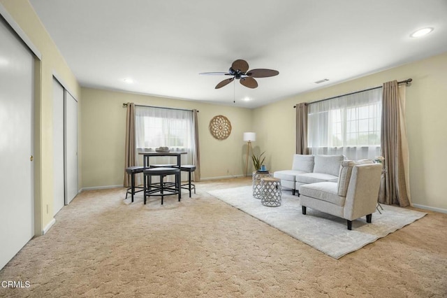 living room with visible vents, a ceiling fan, recessed lighting, carpet floors, and baseboards