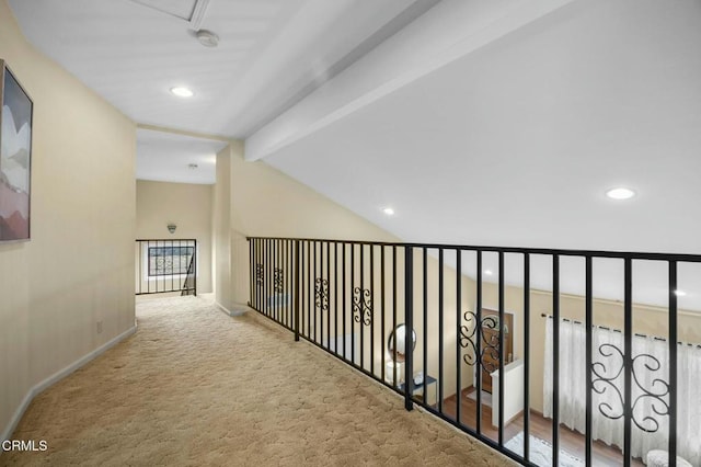 hallway with recessed lighting, carpet flooring, baseboards, and vaulted ceiling with beams