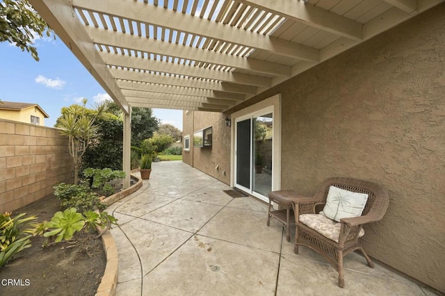 view of patio / terrace with fence