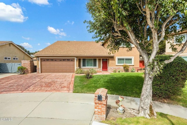 view of front of home with a front yard, an attached garage, stucco siding, stone siding, and decorative driveway