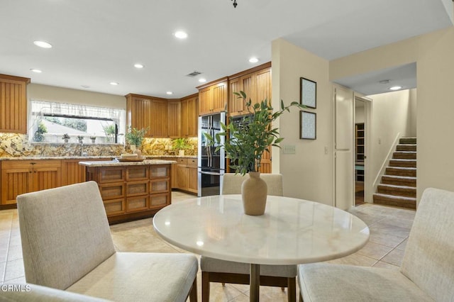 dining room with stairs, light tile patterned floors, recessed lighting, and visible vents