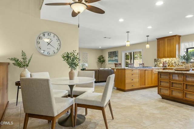 dining area featuring recessed lighting and plenty of natural light