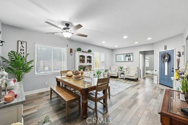 dining room with recessed lighting, baseboards, light wood finished floors, and ceiling fan