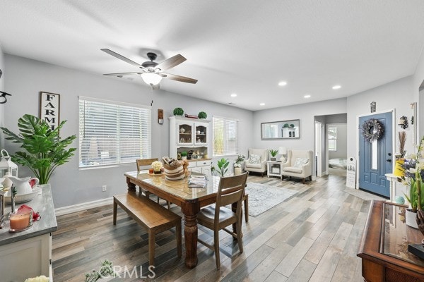 dining area with recessed lighting, baseboards, light wood finished floors, and ceiling fan