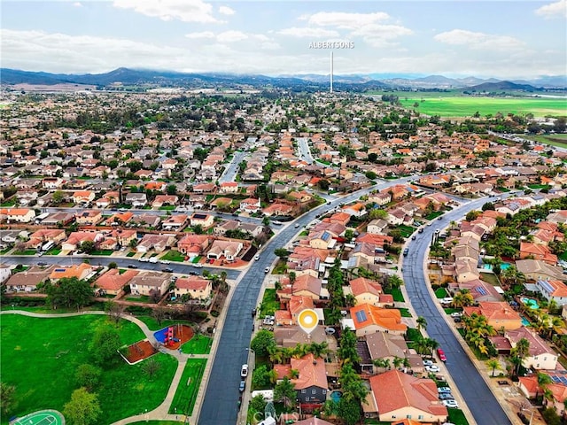 birds eye view of property with a mountain view and a residential view