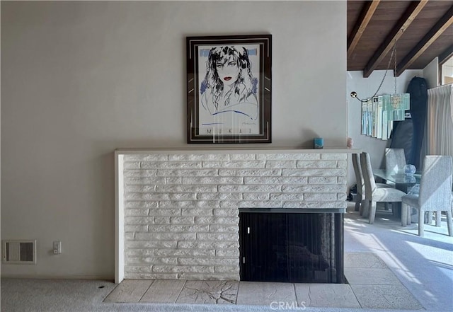 details featuring visible vents, carpet, and a brick fireplace